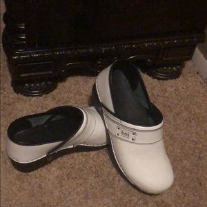 White patent clogs